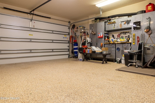 garage with a workshop area