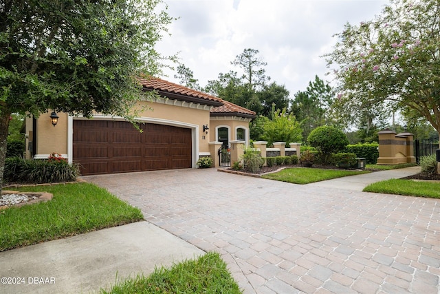 mediterranean / spanish-style house featuring a garage