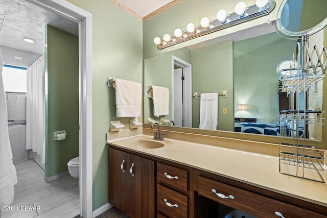 bathroom featuring toilet, curtained shower, hardwood / wood-style flooring, vanity, and crown molding