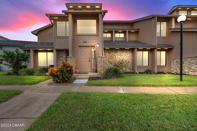 view of front of house with a yard