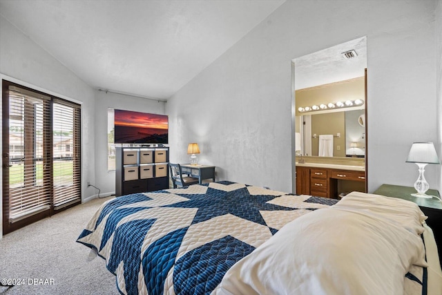 carpeted bedroom featuring access to exterior, vaulted ceiling, and connected bathroom