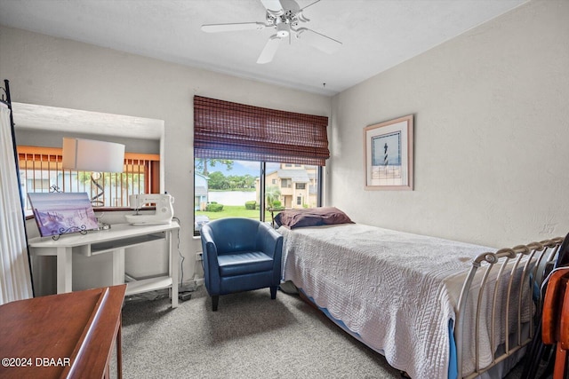 bedroom featuring carpet, multiple windows, and ceiling fan