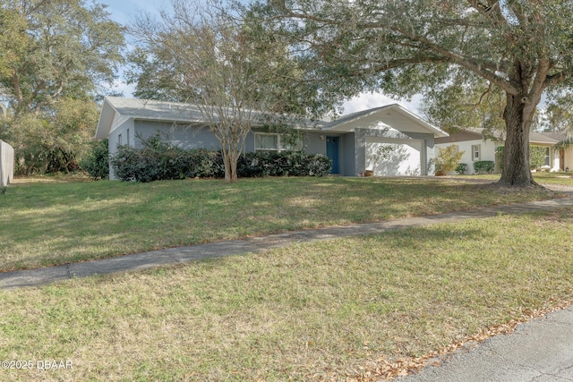 single story home featuring a garage and a front yard