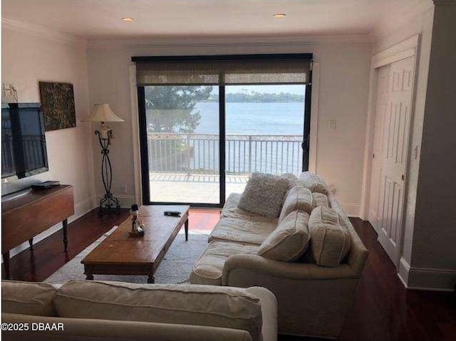 220 John Anderson Dr, Ormond Beach, FL 32176 - living area featuring wood finished floors, baseboards, and crown molding