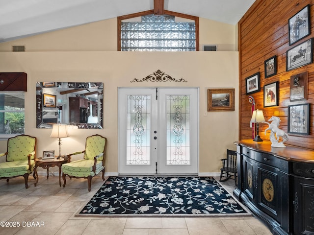 foyer entrance featuring high vaulted ceiling, visible vents, french doors, and tile patterned floors