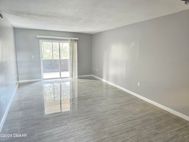 empty room with a textured ceiling