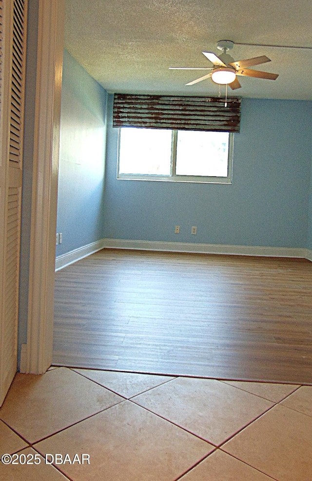 100 Silver Beach Ave Unit 308, Daytona Beach, FL 32118 - tiled spare room with a textured ceiling, baseboards, and ceiling fan