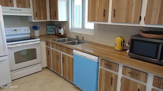 100 Silver Beach Ave Unit 308, Daytona Beach, FL 32118 - kitchen with white electric range, under cabinet range hood, dishwashing machine, a sink, and stainless steel microwave