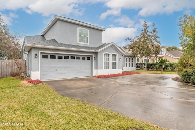 front facade with a garage and a front lawn