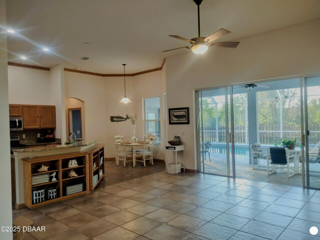 unfurnished room with light hardwood / wood-style floors, crown molding, and plenty of natural light