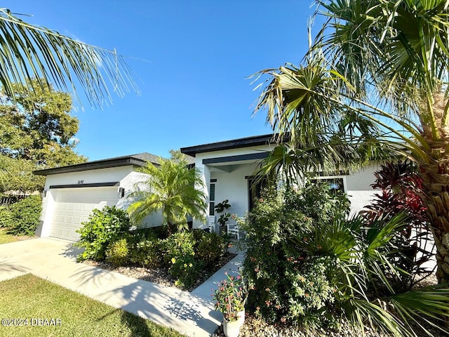 obstructed view of property featuring a garage