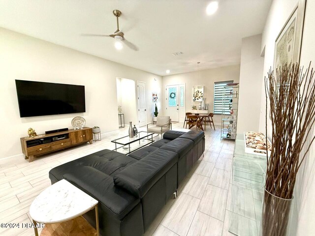 living room featuring ceiling fan