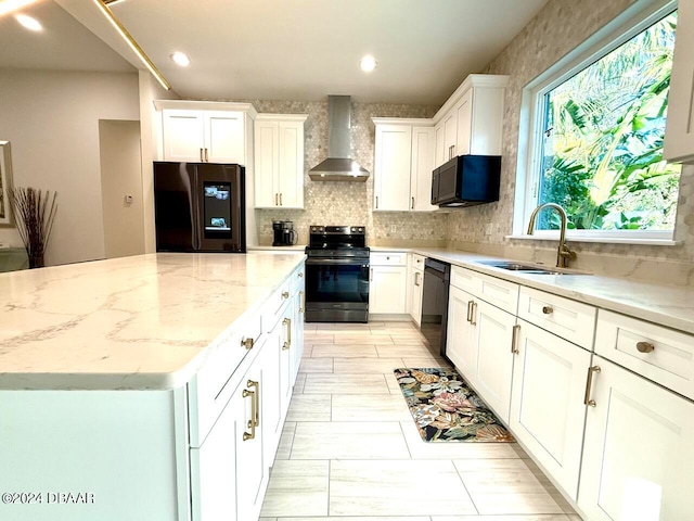 kitchen featuring white cabinets, sink, wall chimney exhaust hood, and stainless steel appliances