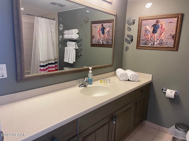 2700 N Atlantic Ave Unit 901, Daytona Beach, FL 32118 - bathroom with vanity, walk in shower, tile patterned flooring, and toilet