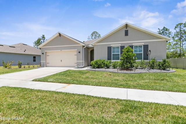 ranch-style home featuring a front lawn and a garage