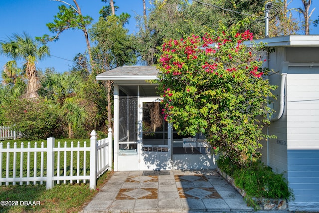 exterior space with a patio area and a sunroom