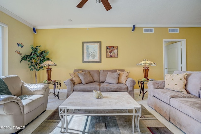 living room featuring ceiling fan and crown molding