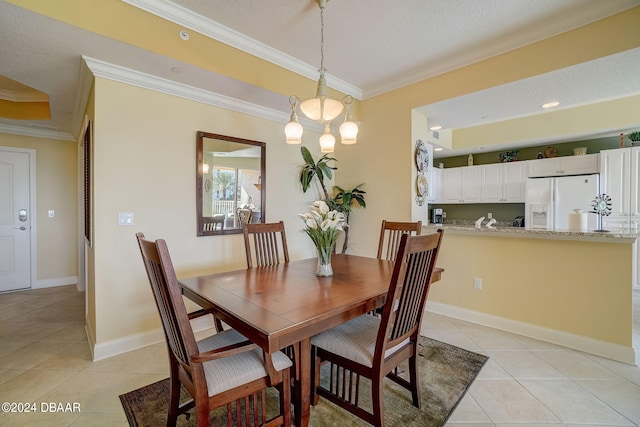 dining space with a chandelier, a textured ceiling, light tile patterned floors, and ornamental molding