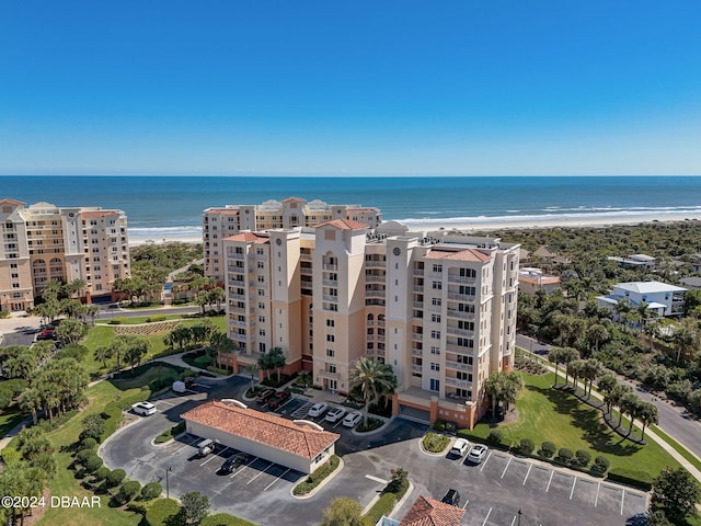 bird's eye view featuring a view of the beach and a water view