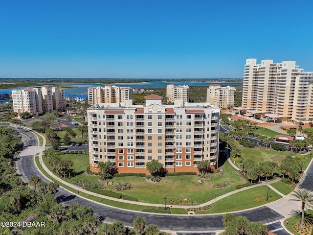 birds eye view of property with a water view