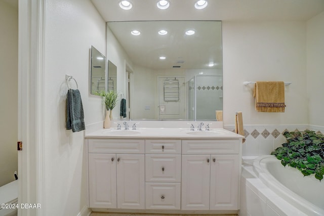 bathroom featuring vanity and plus walk in shower