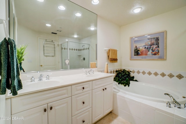 bathroom featuring tile patterned flooring, vanity, and independent shower and bath