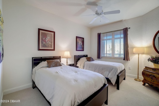 bedroom featuring light carpet and ceiling fan