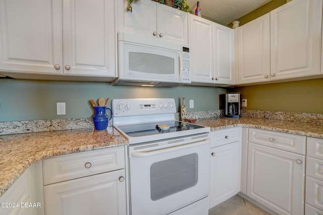 kitchen featuring white appliances and white cabinets