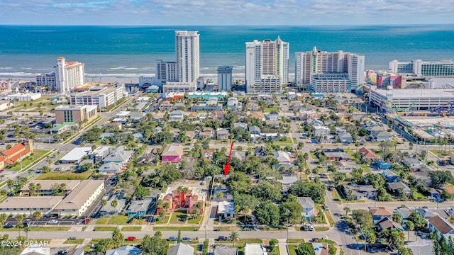 birds eye view of property featuring a view of city and a water view