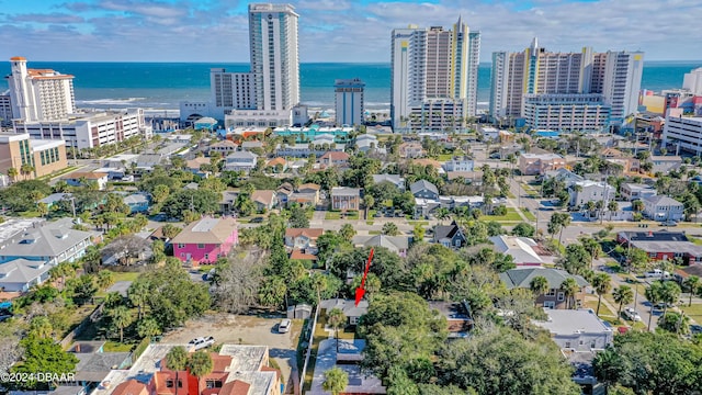 bird's eye view featuring a water view and a view of city