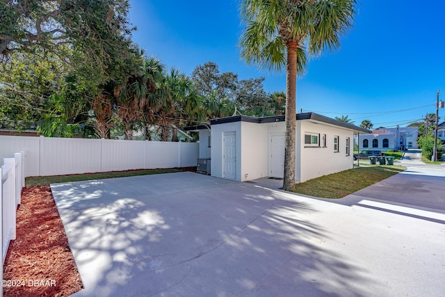 view of property exterior with fence