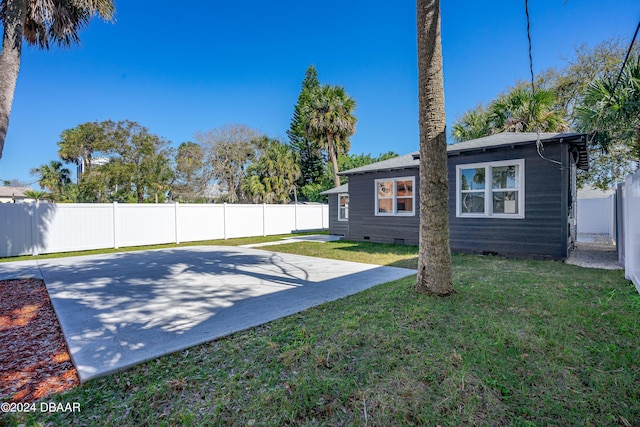 view of yard with a patio and a fenced backyard