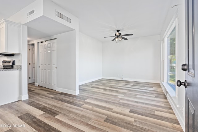 interior space with visible vents, plenty of natural light, light wood-style floors, and a ceiling fan