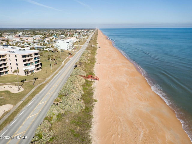 aerial view with a view of the beach and a water view