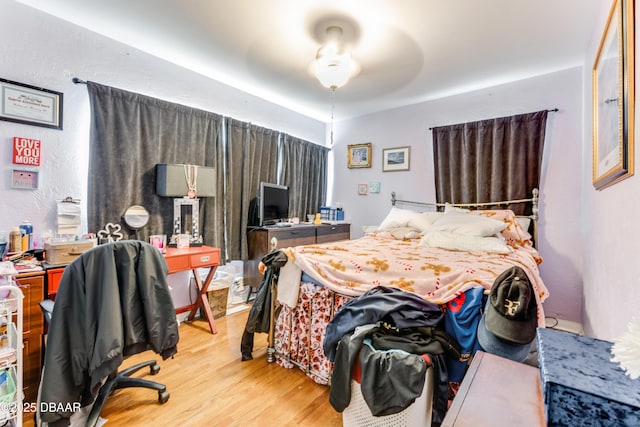 bedroom with light hardwood / wood-style floors