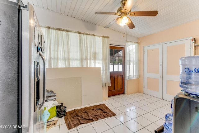 foyer entrance featuring ceiling fan and light tile patterned flooring