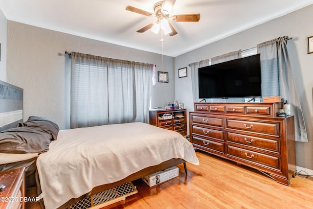 bedroom featuring ceiling fan and light wood-type flooring