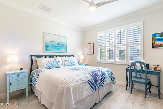 bedroom featuring ornamental molding, light hardwood / wood-style floors, and ceiling fan