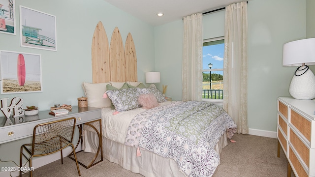 bedroom featuring light carpet