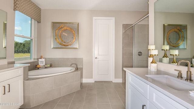 bathroom featuring vanity, independent shower and bath, and tile patterned floors