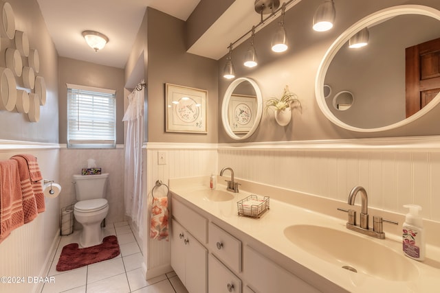 bathroom featuring toilet, vanity, and tile patterned floors