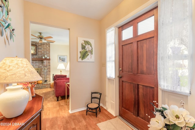 entryway with ceiling fan and light hardwood / wood-style flooring