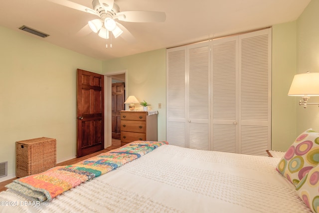 bedroom featuring ceiling fan and a closet