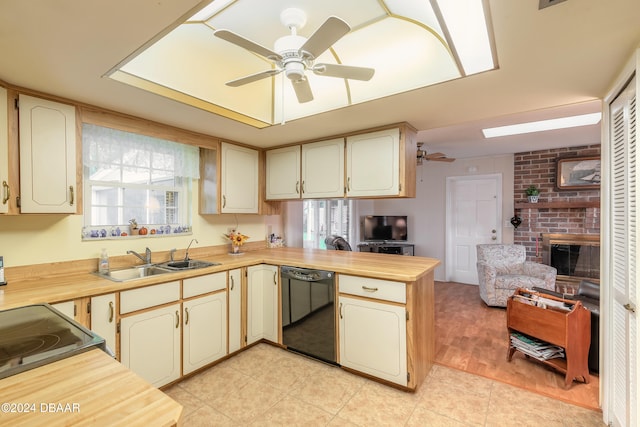 kitchen with ceiling fan, dishwasher, sink, kitchen peninsula, and light wood-type flooring