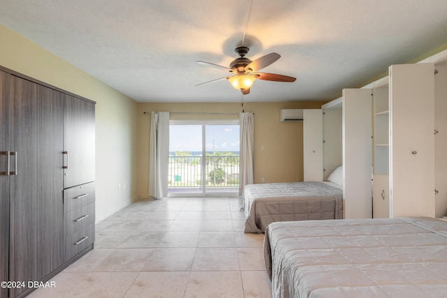 tiled bedroom featuring access to exterior, a textured ceiling, ceiling fan, and a wall mounted air conditioner