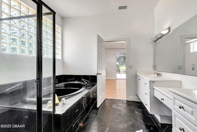 6062 Sabal Crossing Ct, Port Orange, FL 32128 - bathroom featuring vanity, tile patterned flooring, a garden tub, and a stall shower