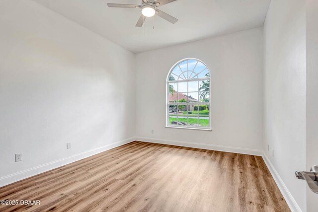6062 Sabal Crossing Ct, Port Orange, FL 32128 - empty room featuring wood finished floors, baseboards, and ceiling fan