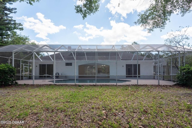 6062 Sabal Crossing Ct, Port Orange, FL 32128 - back of house featuring a yard, a patio area, stucco siding, and an outdoor pool
