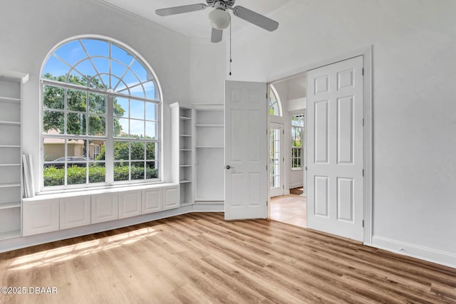 6062 Sabal Crossing Ct, Port Orange, FL 32128 - spare room with light wood-style floors, ceiling fan, plenty of natural light, and ornamental molding