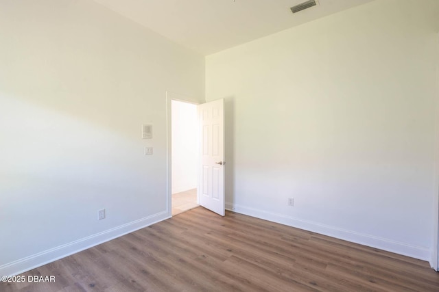 6062 Sabal Crossing Ct, Port Orange, FL 32128 - empty room with wood finished floors and baseboards